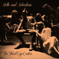 The image is the album cover for Belle and Sebastian - The Third Eye Centre. The cover features a sepia-toned photograph of several people, with the central figure sitting in a chair and others surrounding them in theatrical poses. The lighting casts dramatic shadows. The band's name, Belle and Sebastian, is written in a classic script font in the upper left, while the album title, The Third Eye Centre, is written in a matching style at the bottom left.