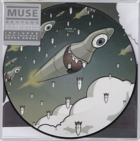 The image is of a vinyl record design for Muse's single Reapers. The artwork features cartoonish missiles or drones with large eyes and menacing grins against a cloudy sky backdrop.