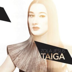 The image features a stylized portrait of a woman with long hair, her face partially overlaid by geometric shapes. She is wearing an avant-garde, sculptural garment that fans out around her shoulders.