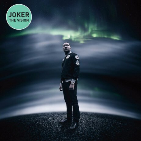 The album cover features a surreal, digitally enhanced photograph of the artist standing on a dark landscape under a dramatic sky. The background displays a swirling pattern of clouds and the vibrant colors of the Northern Light. The artist is dressed in a black jacket with patches.