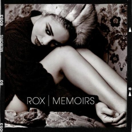 The image is the album cover for "Memoirs" by Rox. The cover features a black-and-white photo of the artist, Rox, sitting curled up in a contemplative pose, with soft textures.