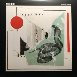 The image is the album cover for Metz - Strange Peace. The cover features a collage-style design with layered torn paper, including a drawing of a coiled snake on the right-hand side. A red circle is placed on the left, adding a pop of color to the otherwise muted color palette of whites, greens, and blacks. The collage is a fragmented, chaotic aesthetic. The band's name "Metz" is located at the top left, and the album title "Strange Peace" is in the top right corner.