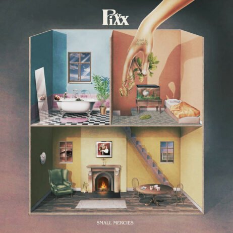 The image is the album cover for "Small Mercies" by Pixx. The cover features a dollhouse-like structure with different rooms, each filled with surreal, dream-like elements, including a giant hand dropping leaves into the top room.