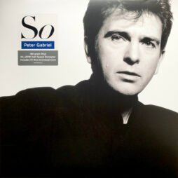 The image is the album cover for "So" by Peter Gabriel. It features a black-and-white portrait of Peter Gabriel against a plain white background. His expression is serious, with a direct gaze at the viewer. The album title "So" is displayed in the top left corner in a minimalist serif font, with "Peter Gabriel" written below in a smaller, blue rectangle.