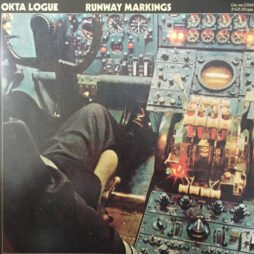 The image is the album cover for Okta Logue - Runway Markings. The cover features a detailed, vintage-style photograph of an airplane cockpit, focusing on the numerous dials, controls, and instruments. The image has a close-up view of the pilot's seat and controls. The title "Runway Markings" and the band name "Okta Logue" are displayed at the top in simple, bold fonts.