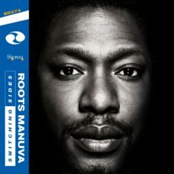 The imageof the album cover for Roots Manuva - Switching Sides. The artwork features a close-up, black-and-white portrait of Roots Manuva's face. On the left side of the cover, there is a blue vertical banner with text that includes the album title, "Switching Sides," and the artist's name, "Roots Manuva." The clean, minimalist design highlights the artist's face, giving the cover a bold and striking appearance.