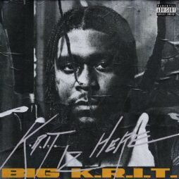 This image is the album cover for "K.R.I.T. Iz Here" by Big K.R.I.T. It features a black-and-white close-up portrait of Big K.R.I.T. with a serious expression, framed in a textured, distressed look as if the image is printed on crumpled paper. The album title "K.R.I.T. Iz Here" is handwritten in a stylized font across the image. At the bottom, the artist's name "Big K.R.I.T." is displayed in bold, blocky, yellow letters. The cover has a gritty, raw aesthetic that matches the tone of the music. There is also an explicit content warning in the top right corner.