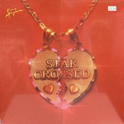 This image is the album cover for "Star-Crossed" by Kacey Musgraves. The design features a golden heart-shaped pendant split in two, resembling a broken heart necklace. The words "STAR CROSSED" are engraved across both halves of the heart, with small heart symbols below the text on each piece. The background is a rich, solid red. In the upper left corner, Kacey Musgraves' name is written in a stylish cursive font.