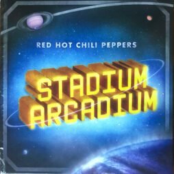 A cosmic-themed album cover featuring the title "Stadium Arcadium" in bright yellow 3D letters. Above it, "Red Hot Chili Peppers" is written in white. The background is a deep blue space with planets and glowing stars, creating a vibrant and ethereal atmosphere. A planetary ring circles the text, emphasizing the galactic vibe.