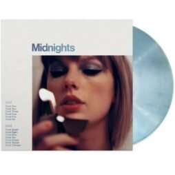 The album cover of "Midnights" features a close-up of Taylor Swift with a focused expression, holding a lit lighter in her hand. She is wearing bold, shimmering blue eyeshadow, adding to the moody aesthetic. The album title "Midnights" is displayed in simple, understated text at the top left of the cover. To the left of her image, there is a list of track numbers from one to thirteen. The vinyl itself is visible in the background, featuring a marbled light blue design that complements the coverâ€™s cool, ethereal tones.