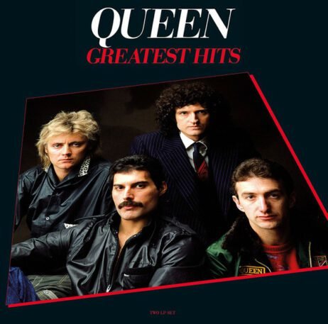 The image is the album cover for "Greatest Hits" by Queen. It features a photograph of the four band members: Roger Taylor, Freddie Mercury, Brian May, and John Deacon. They are dressed in a variety of outfits, with Brian May in a striped suit, Freddie Mercury in a black leather jacket, Roger Taylor in a dark coat, and John Deacon in a green jacket. The band's name "QUEEN" is displayed in bold white letters at the top, with "GREATEST HITS" in red beneath it. The background is dark, with a slight red outline around the photo.