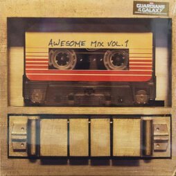 The image is the album cover for "Awesome Mix Vol. 1," the soundtrack for the movie "Guardians of the Galaxy." It features a vintage cassette tape with the label "Awesome Mix Vol. 1" written in a handwritten style. The cassette is enclosed in a cassette player or case, with metallic buttons at the bottom. The cover has a retro aesthetic, reflecting the mixtape's 1970s and 1980s music collection.
