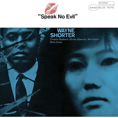 The album cover of Speak No Evil by Wayne Shorter features a dark blue monochromatic image with two distinct faces: one of Wayne Shorter on the left and an unidentified woman on the right. The title "Speak No Evil" appears above in a simple font with a red lipstick kiss mark.