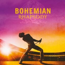 The Bohemian Rhapsody album cover features a silhouette of a performer, reminiscent of Freddie Mercury, in a dynamic pose on stage, holding a microphone. The background transitions from a deep purple at the top to a vibrant orange and yellow gradient, symbolizing the energy of a live performance. The title "BOHEMIAN RHAPSODY" is written in bold yellow and orange text, with the iconic Queen crest subtly visible in the background.