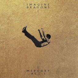 The album cover for Mercury - Act 1 by Imagine Dragons features a minimalist design with a gold-textured background. A small, dark silhouette of a person is seen falling or floating in the center, creating a striking contrast against the bright backdrop. The band's name "IMAGINE DRAGONS" is written in an elegant, uppercase font at the top, and the album title "MERCURY ACT 1" is placed at the bottom, separated by a thin vertical line.