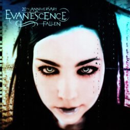 The cover of *Fallen (20th Anniversary)* by Evanescence features an intense close-up of lead singer Amy Lee's face, bathed in cool blue and purple tones. Her dramatic, dark eye makeup contrasts with her pale complexion, and her piercing gaze is the focal point of the design. The band name "Evanescence" and the album title are written in an ornate, gothic font at the top left, with "20th Anniversary" emphasized above.