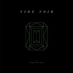 The album cover features a black background with a minimalist design. At the center is a green, geometric outline resembling a gemstone. Above the gemstone, the text "VIDE NOIR" is written in a thin, elegant font. Below the gemstone, in smaller letters, it says "by LORD HURON."