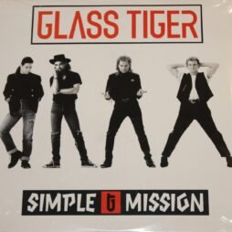 The image shows the album cover for Glass Tiger: Simple Mission. The image is black-and-white and of four men standing in a row, each with distinct poses and outfits. The text "GLASS TIGER" is prominently displayed in bold, red lettering within a rectangular border. Below the image, the title "SIMPLE MISSION" appears in a stylized black font, with a red "G" symbol between the words. The men in the image have rock-inspired attire.