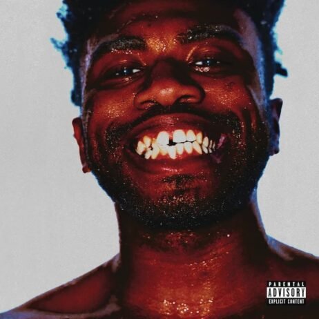 This is the album cover for Kevin Abstract - Arizona Baby. It features a close-up photo of a man smiling widely, showing his teeth. His skin is glistening with sweat or water droplets. The background is plain, focusing all attention on his expressive face. In the lower right corner is the "Parental Advisory" label.