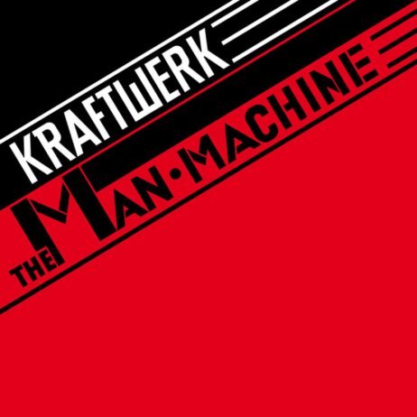 The image is the album cover for "The Man-Machine" by Kraftwerk. It features a bold, geometric design with a diagonal black and red split. The band's name, "KRAFTWERK," is written in white, capitalized text at the top, while the album title "THE MANâ€¢MACHINE" appears in black and red, using a modern, industrial font.