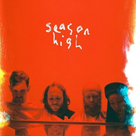 This is the album cover for Little Dragon - Season High. It features for human faces at the bottom blurred against a red background.